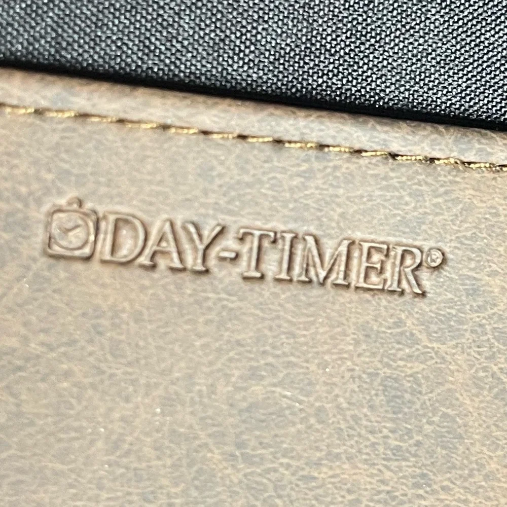 Day Timer Brown Folder With Some Papers